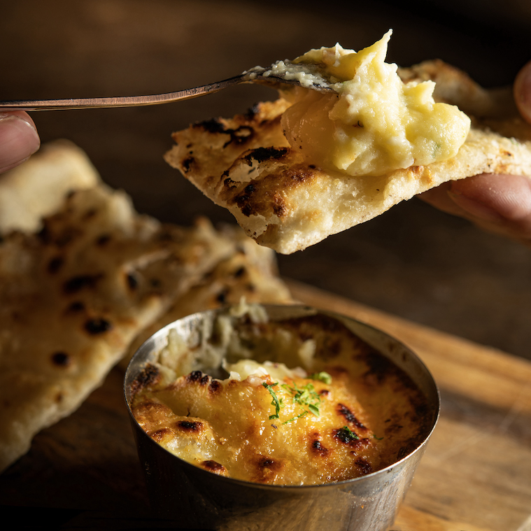 Baked Mashed Potato and House-made Raclette Cheese 