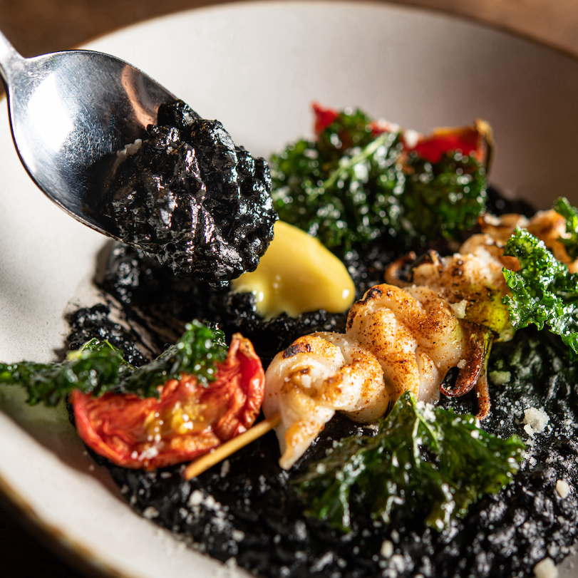 Squid ink Risotto with Semi Dried Tomato and House-made Aioli Sauce